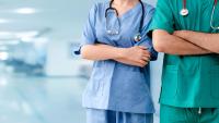 Two medical students wearing scrubs
